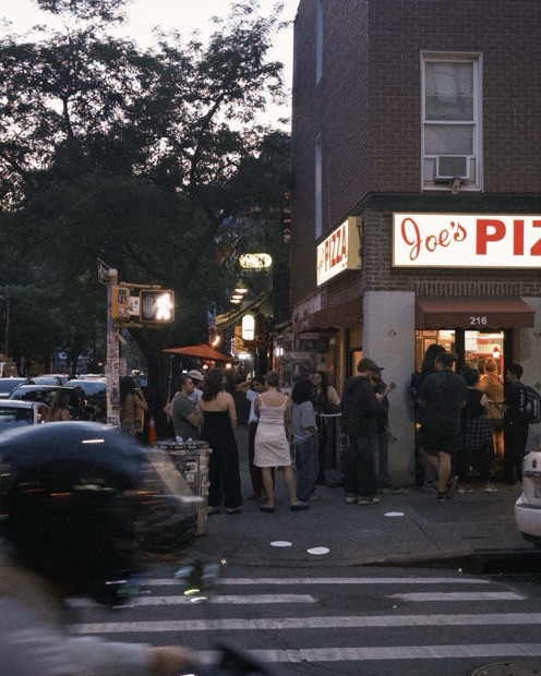 Joe's Pizza corner at dusk
