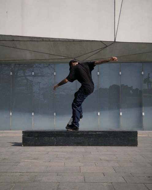 Backside tailslide by the glass wall